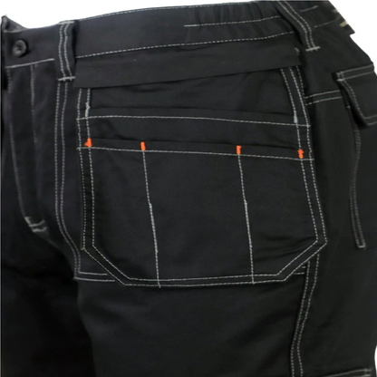 Close-up of black pants with orange accents on a white background