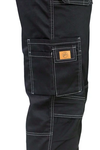 Close-up of black cargo pants with white contrast stitching and a small tan brand patch on the cargo pocket, shown against a white background.